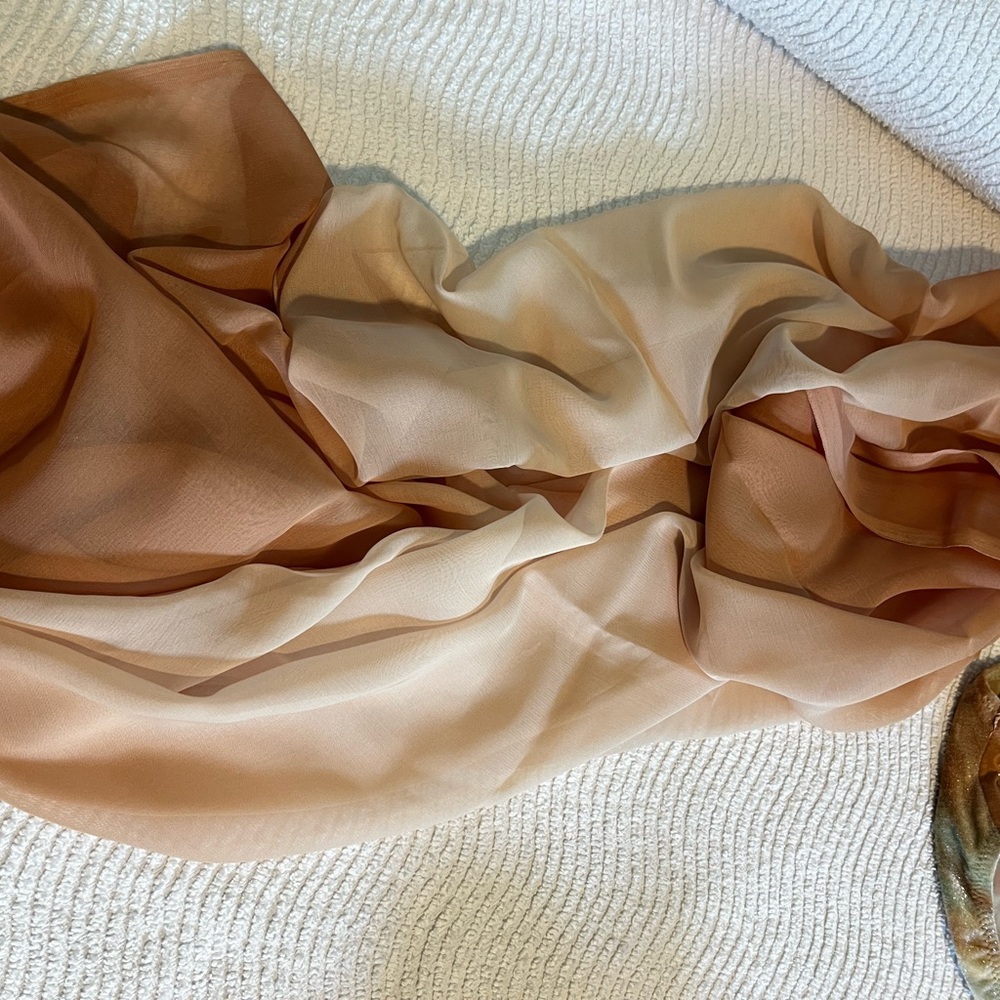 Sarong wrap; peach/ orange hues.